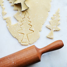 Load image into Gallery viewer, rolling pin next to dough being cut into christmas tree design
