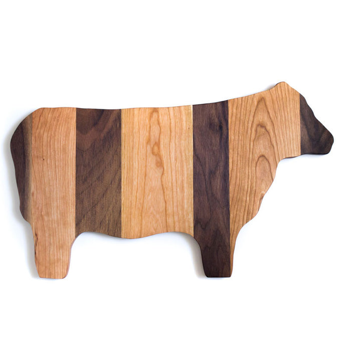striped cow cutting board