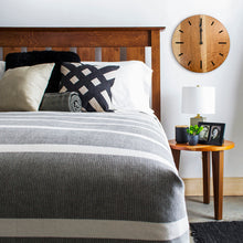 Load image into Gallery viewer, cherry savanna gallery clock next to a bed and above a bedside table