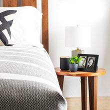 Load image into Gallery viewer, savanna end table with pictures and lamp next to a bed